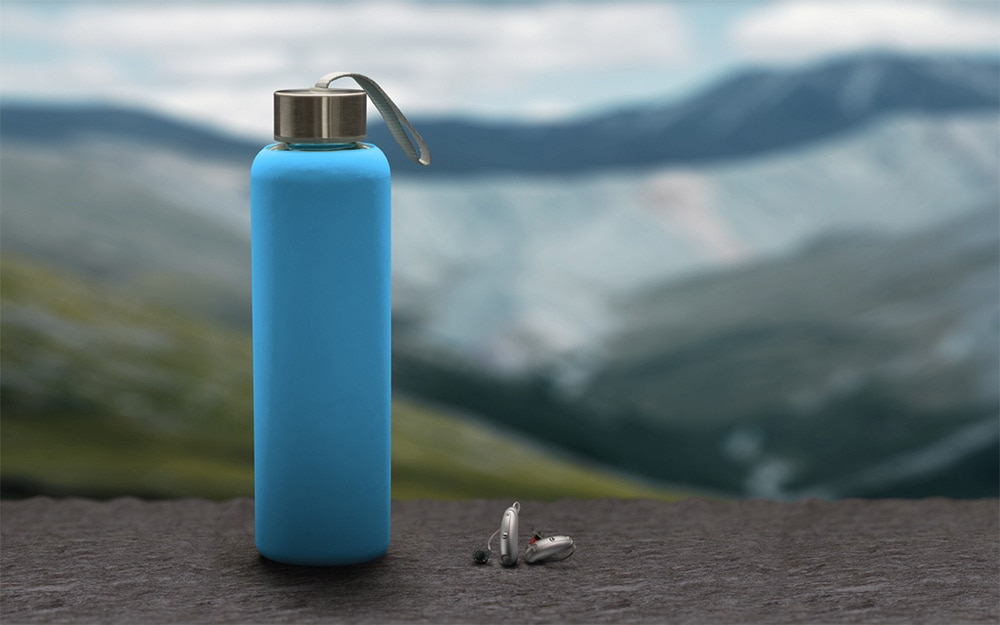 Moxi Fit Hearing Aid In Pewter Color Hiking Water Bottle Size Comparison